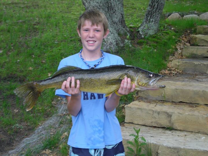 Boy holding large fish from Whitefish Lake in Minnesota