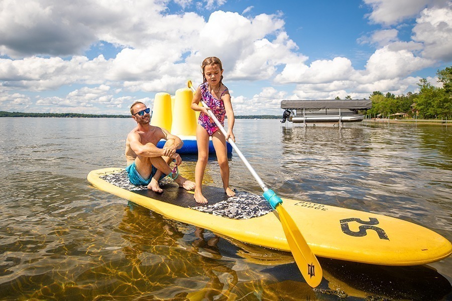 Water activities, including paddle boarding, at Boyd Lodge, a Minnesota summer family getaway