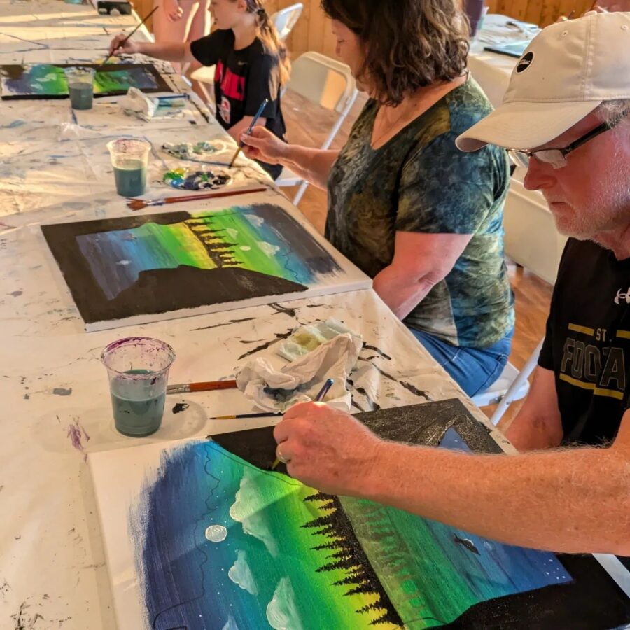 People painting during a painting class.