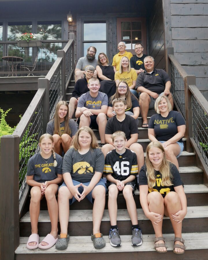 The Anderson family posing for a group photo on the steps of the Lodge building.